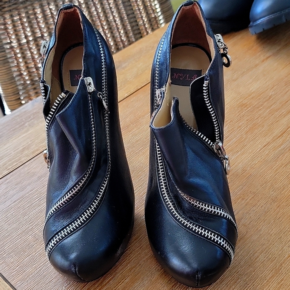 Black booties with zipper accent